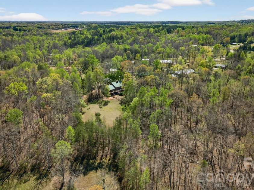 405 Loop Road, Campobello, SC 29322.  MLS# CAR4370899, YatesRealty ID 14181. Looking for privacy and peace? 6+ acres surrounded by trees with barn and pasture.