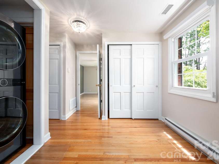 200 Allen Mountain Drive, Black Mountain, NC 28711.  MLS# CAR4329989, YatesRealty ID 14185. Laundry area in the Primary bedroom area with dual closets directly off the primary bedroom which is on the main level. 