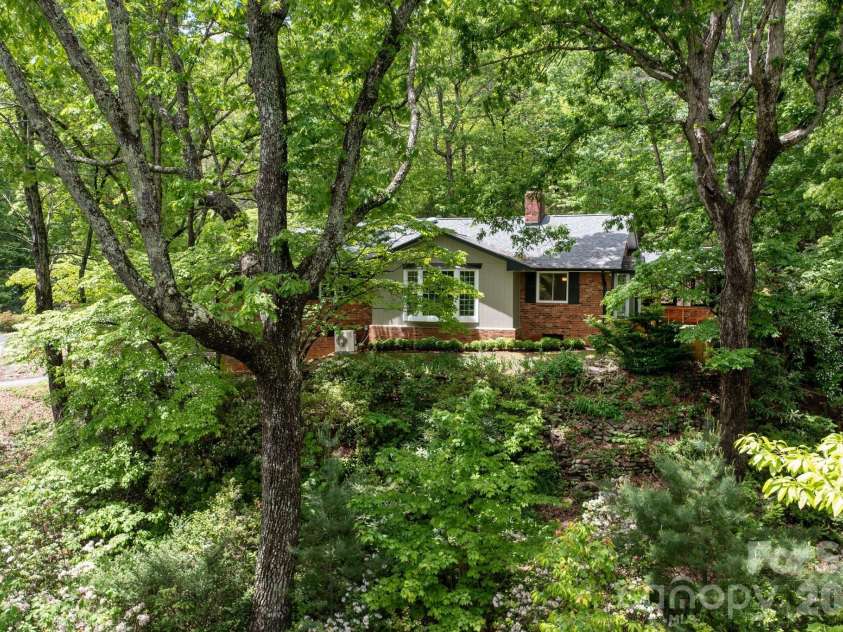 200 Allen Mountain Drive, Black Mountain, NC 28711.  MLS# CAR4329989, YatesRealty ID 14185. Mature trees and lush landscaping all around.