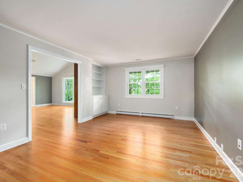 200 Allen Mountain Drive, Black Mountain, NC 28711.  MLS# CAR4329989, YatesRealty ID 14185. Room off the living room could make for a formal dining room, office, den, yoga room or ______!