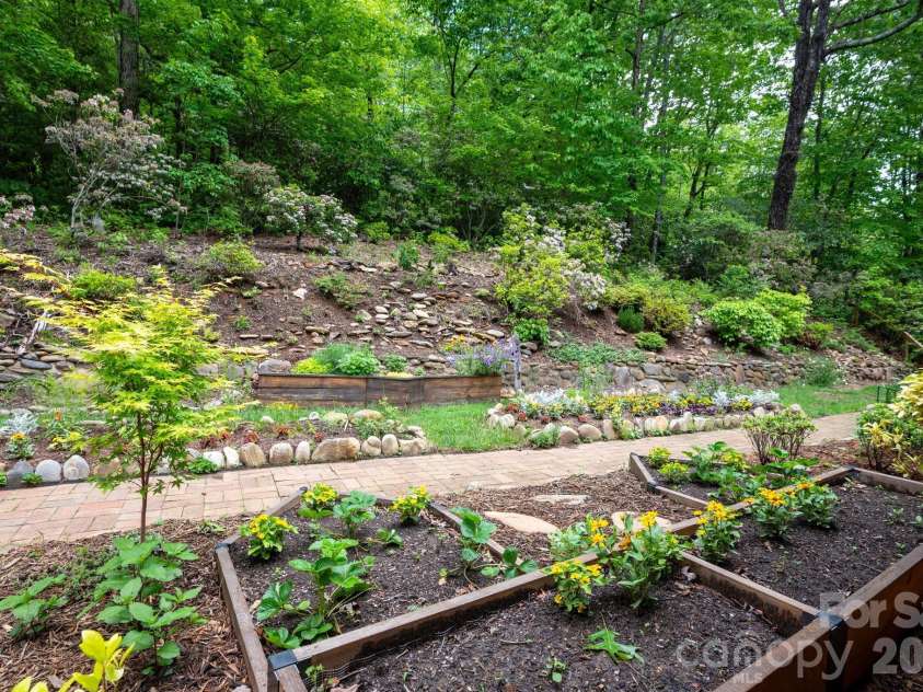 200 Allen Mountain Drive, Black Mountain, NC 28711.  MLS# CAR4329989, YatesRealty ID 14185. Wonderful garden beds and landscaping.