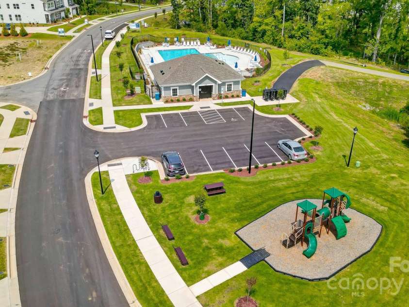 6266 Tea Olive Drive, Harrisburg, NC 28075.  MLS# CAR4251541, YatesRealty ID 14186. Aerial shots of pool and playground.