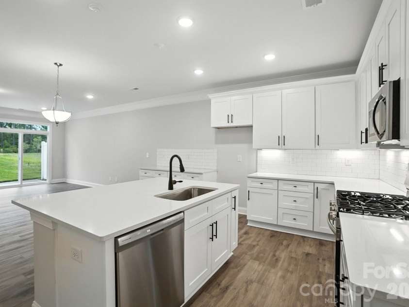 6266 Tea Olive Drive, Harrisburg, NC 28075.  MLS# CAR4251541, YatesRealty ID 14186. Kitchen and dining area