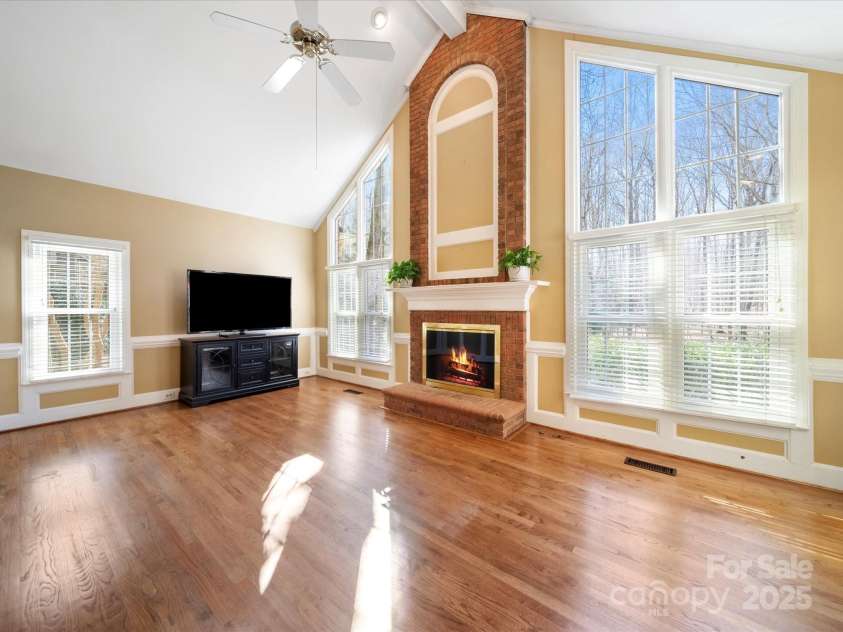2217 Blue Bell Lane, Charlotte, NC 28270.  MLS# CAR4228161, YatesRealty ID 1419. Family room-Look at that wall of windows!