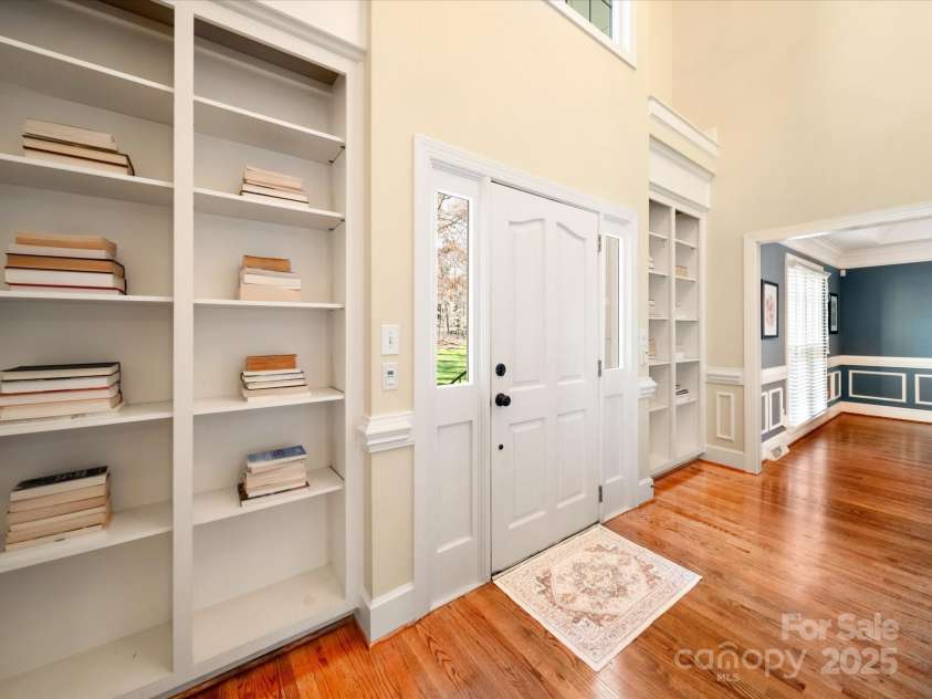 2217 Blue Bell Lane, Charlotte, NC 28270.  MLS# CAR4228161, YatesRealty ID 1419. Foyer with floor to ceiling bookcases