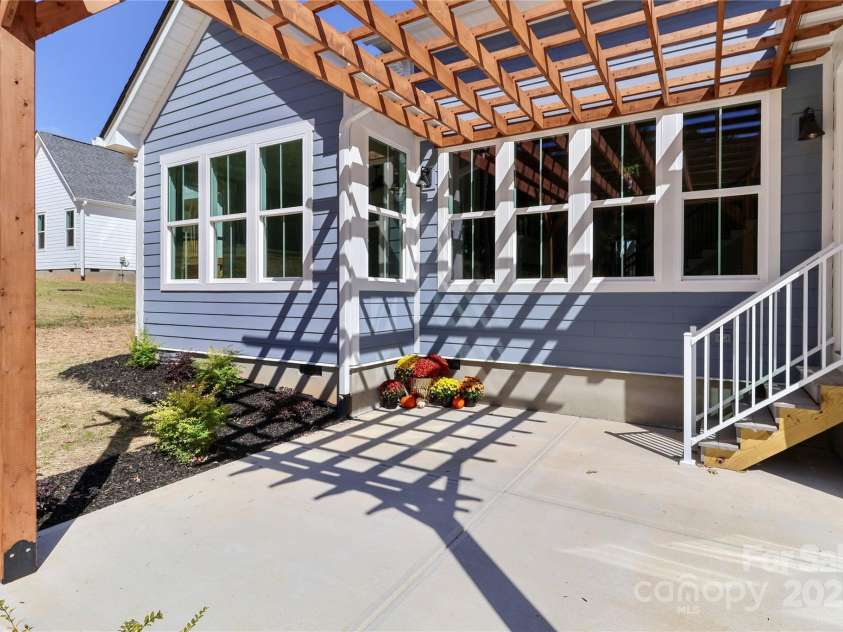 4265 Candlewood Drive, Sherrills Ford, NC 28673.  MLS# CAR4325234, YatesRealty ID 14192. Designed to enhance outdoor living, offering a comfortable and versatile space for all seasons. The thoughtful design prioritizes both functionality and aesthetic appeal.