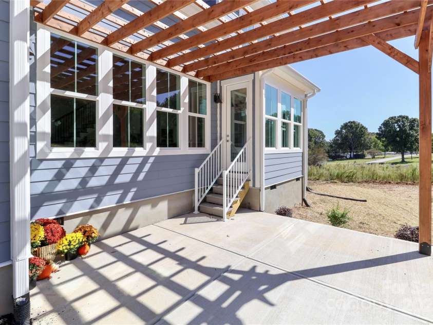 4265 Candlewood Drive, Sherrills Ford, NC 28673.  MLS# CAR4325234, YatesRealty ID 14192. Enjoy the custom-built pergola, which serves as a peaceful outdoor space, enhancing both the aesthetic appeal and entertainment options for your home. 