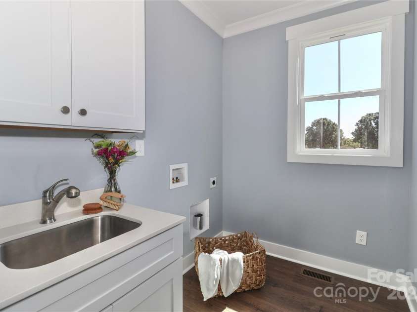 4265 Candlewood Drive, Sherrills Ford, NC 28673.  MLS# CAR4325234, YatesRealty ID 14192. The conveniently placed laundry room offers practicality and ease, streamlining household chores.