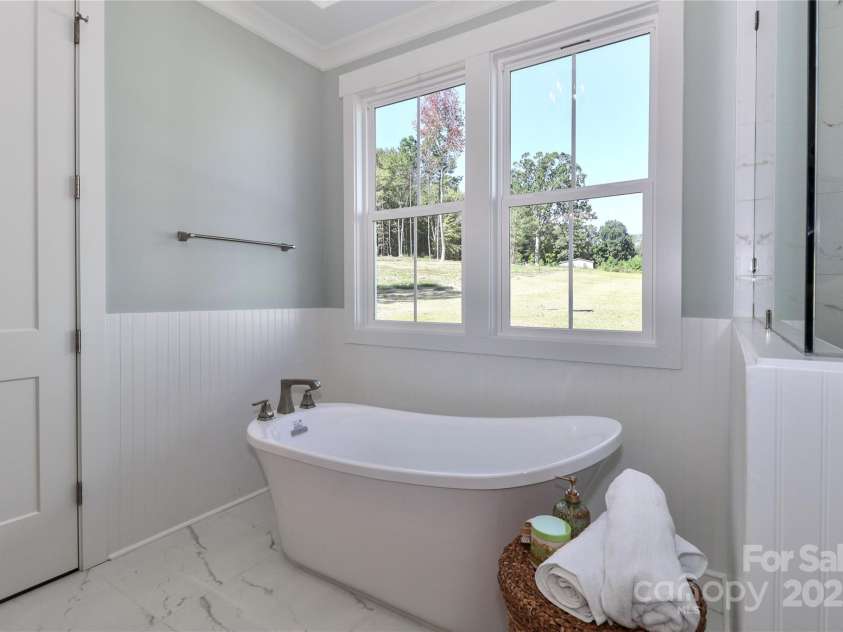 4265 Candlewood Drive, Sherrills Ford, NC 28673.  MLS# CAR4325234, YatesRealty ID 14192. The primary bathroom is all about luxury and relaxation.