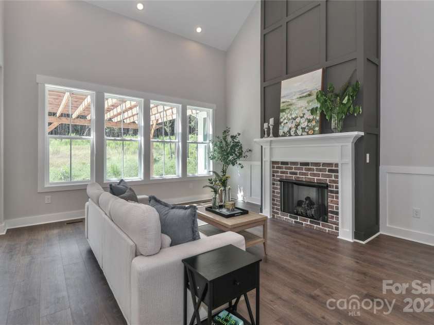 4265 Candlewood Drive, Sherrills Ford, NC 28673.  MLS# CAR4325234, YatesRealty ID 14192. The stunning and cozy gas fireplace anchors the living room with warmth and elegance.