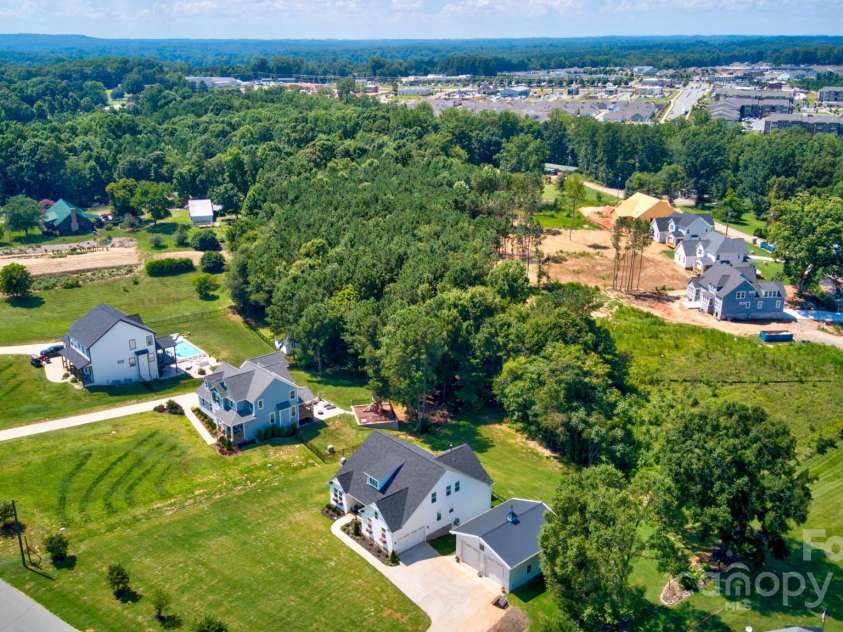 4265 Candlewood Drive, Sherrills Ford, NC 28673.  MLS# CAR4325234, YatesRealty ID 14192. This beautiful home is perfectly situated in a desirable neighborhood, surrounded by stately custom-built properties, showcasing the area's unique character and attention to detail.