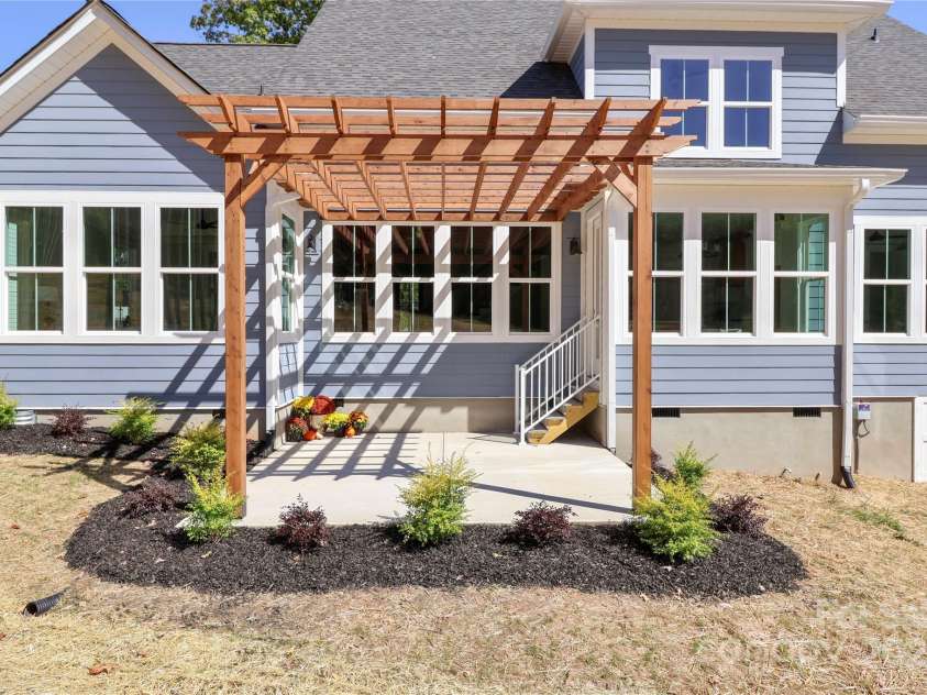 4265 Candlewood Drive, Sherrills Ford, NC 28673.  MLS# CAR4325234, YatesRealty ID 14192. This structure provides a tranquil setting for relaxation and social gatherings, transforming your backyard into an inviting extension of your living area.