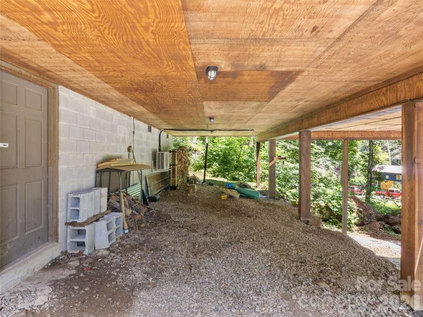 170 Mountain Farm Road, Burnsville, NC 28714.  MLS# CAR4362361, YatesRealty ID 14198. Covered are under home