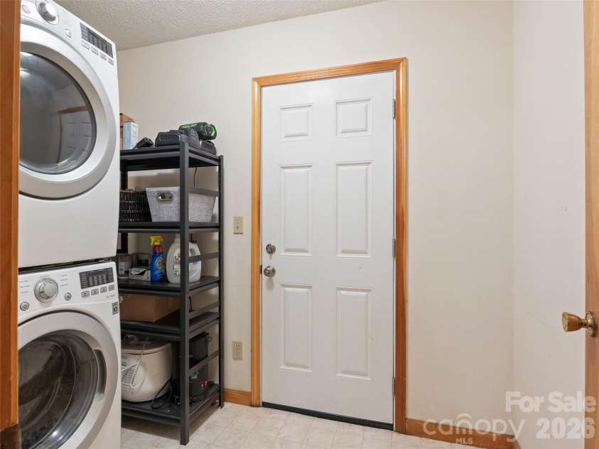 170 Mountain Farm Road, Burnsville, NC 28714.  MLS# CAR4362361, YatesRealty ID 14198. Laundry room and rear exit