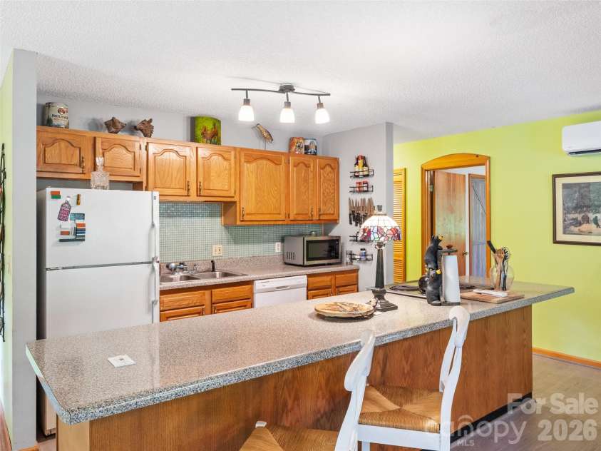 170 Mountain Farm Road, Burnsville, NC 28714.  MLS# CAR4362361, YatesRealty ID 14198. Open kitchen with Island for entertaining.