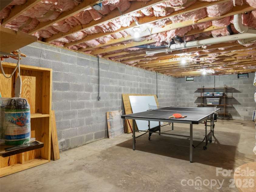 170 Mountain Farm Road, Burnsville, NC 28714.  MLS# CAR4362361, YatesRealty ID 14198. Unfinished basement