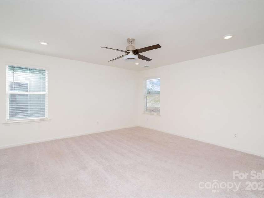 5013 Dunsford Drive, Denver, NC 28037.  MLS# CAR4235751, YatesRealty ID 14198. Primary Bedroom from another angle that showcases the ample natural light that enters the room