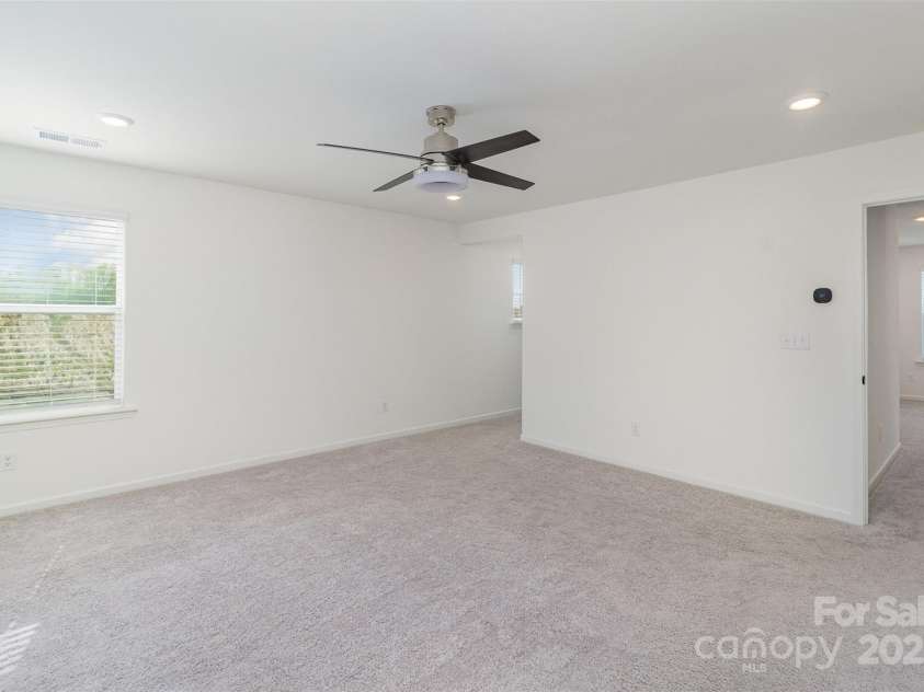 5013 Dunsford Drive, Denver, NC 28037.  MLS# CAR4235751, YatesRealty ID 14198. Primary bedroom's access to the ensuite bath