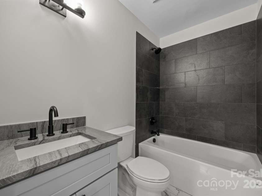 117 Third Street, Asheville, NC 28803.  MLS# CAR4293672, YatesRealty ID 1420. Lower level full bath