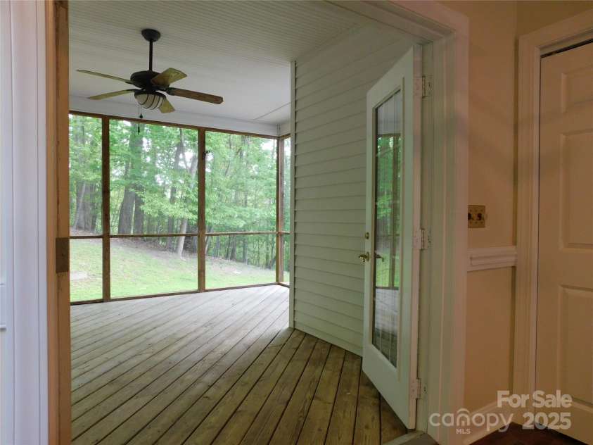 1064 Skye Drive, Pisgah Forest, NC 28768.  MLS# CAR4238839, YatesRealty ID 14202. Access to screened-in porch from kitchen.