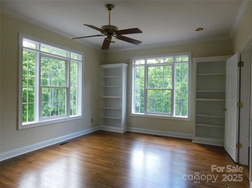 1064 Skye Drive, Pisgah Forest, NC 28768.  MLS# CAR4238839, YatesRealty ID 14202. Plenty of light and built in bookcases beckons the one who enjoys reading in bed.