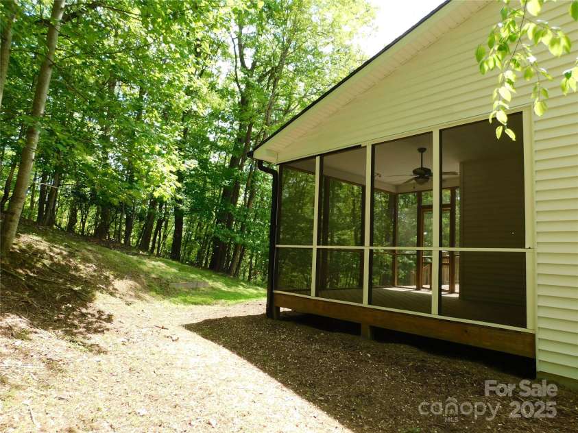1064 Skye Drive, Pisgah Forest, NC 28768.  MLS# CAR4238839, YatesRealty ID 14202. Screened-in porch offers pest-free peace.