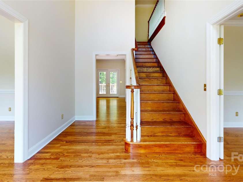 1064 Skye Drive, Pisgah Forest, NC 28768.  MLS# CAR4238839, YatesRealty ID 14202. Staircase leading to second floor.