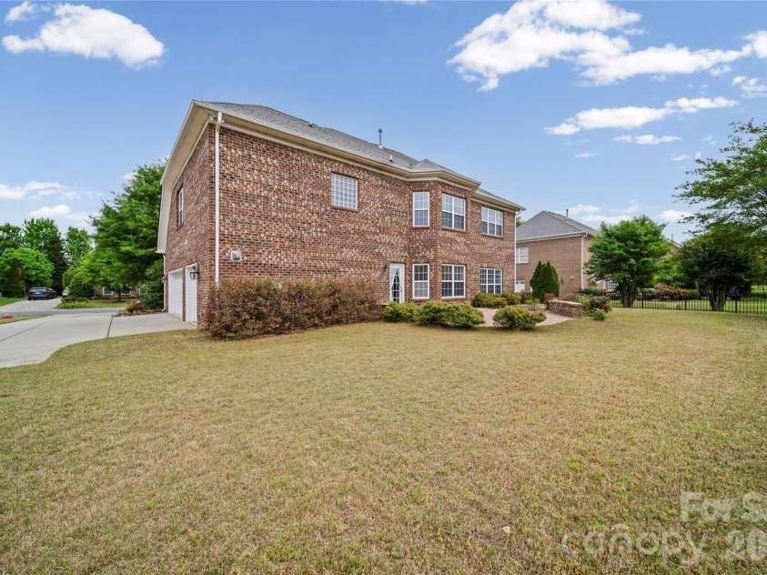 8734 Savannah Road, Harrisburg, NC 28075.  MLS# CAR4371873, YatesRealty ID 14204. Backyard Exterior