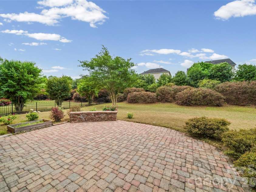 8734 Savannah Road, Harrisburg, NC 28075.  MLS# CAR4371873, YatesRealty ID 14204. Backyard views