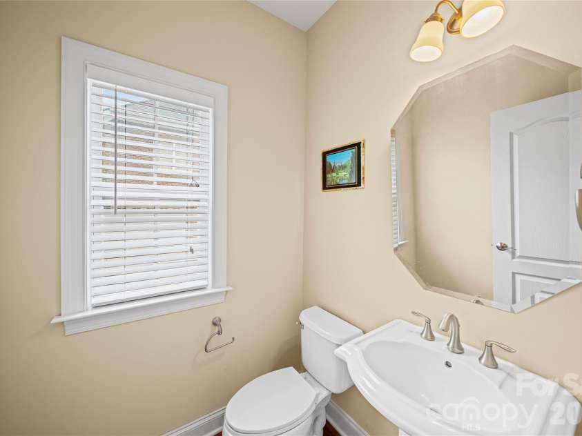 8734 Savannah Road, Harrisburg, NC 28075.  MLS# CAR4371873, YatesRealty ID 14204. Downstairs Half Bath