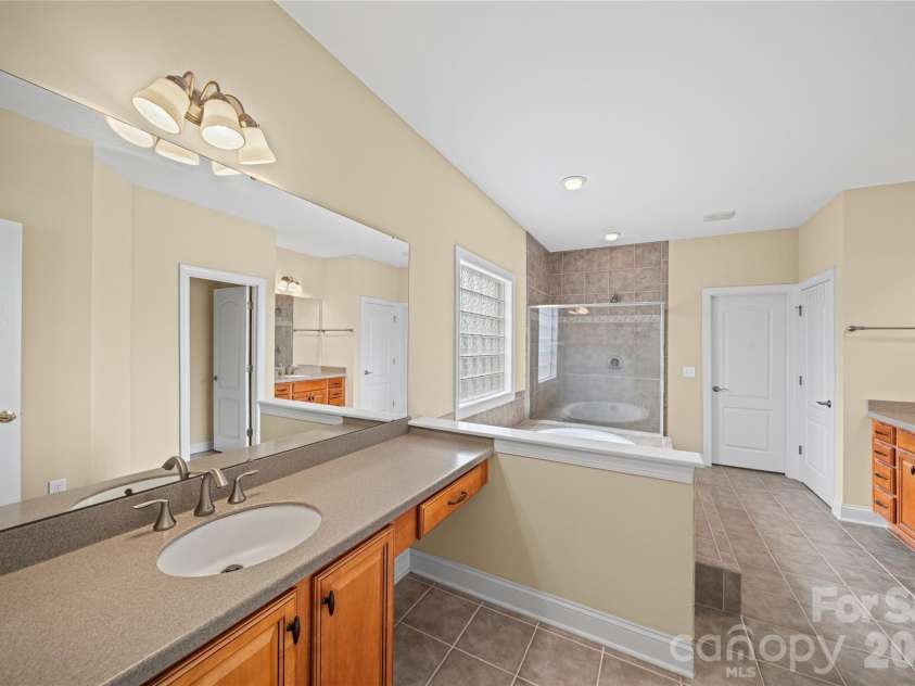 8734 Savannah Road, Harrisburg, NC 28075.  MLS# CAR4371873, YatesRealty ID 14204. Primary Bathroom