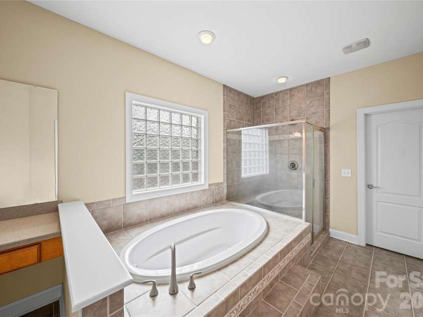 8734 Savannah Road, Harrisburg, NC 28075.  MLS# CAR4371873, YatesRealty ID 14204. Primary Bathroom