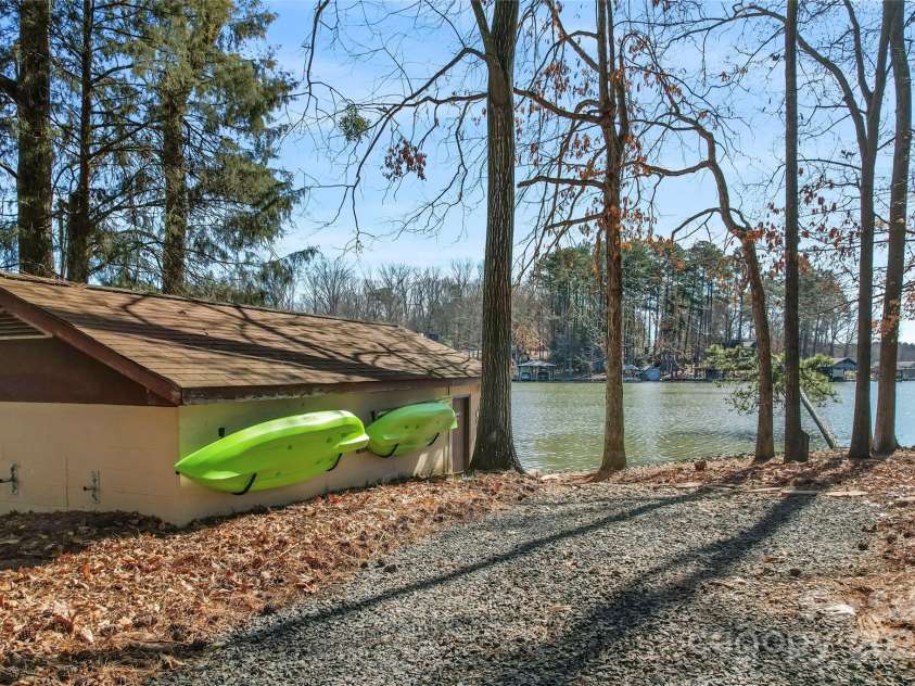 693 Emerald Shores Road, Mount Gilead, NC 27306.  MLS# CAR4225692, YatesRealty ID 14207. Driveway extends to dock.
