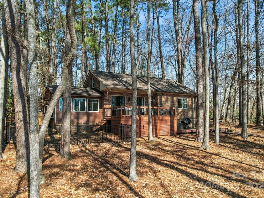 693 Emerald Shores Road, Mount Gilead, NC 27306.  MLS# CAR4225692, YatesRealty ID 14207. Fenced in side yard.