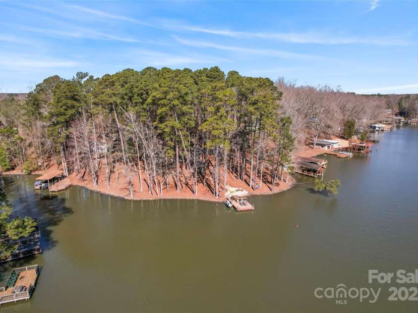 693 Emerald Shores Road, Mount Gilead, NC 27306.  MLS# CAR4225692, YatesRealty ID 14207. View of lake frontage!