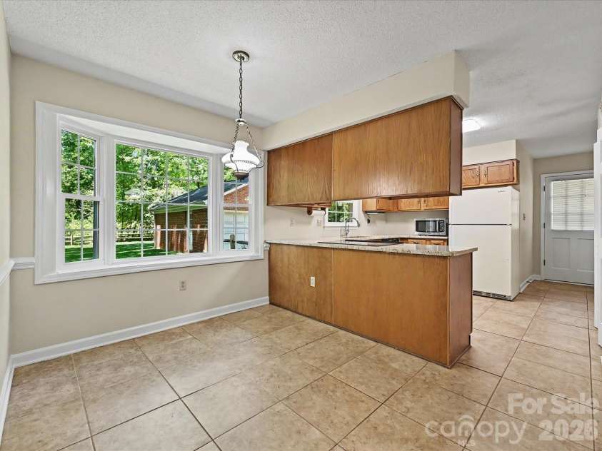 8242 Charles Crawford Drive, Charlotte, NC 28269.  MLS# CAR4371722, YatesRealty ID 14208. 