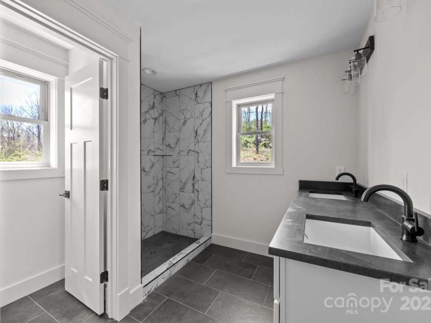93 Glendale Avenue, Asheville, NC 28803.  MLS# CAR4234072, YatesRealty ID 1421. Primary bath with double vanities