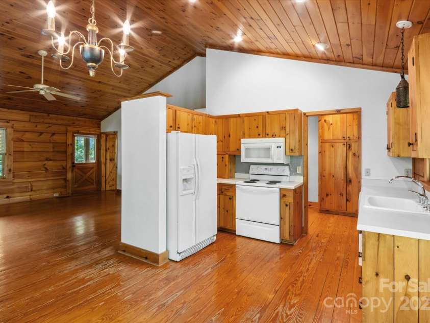 447 Cherokee Circle, Tryon, NC 28782.  MLS# CAR4315695, YatesRealty ID 14222. Great kitchen area, with laundry and pantry off to the side, this is from dining area!