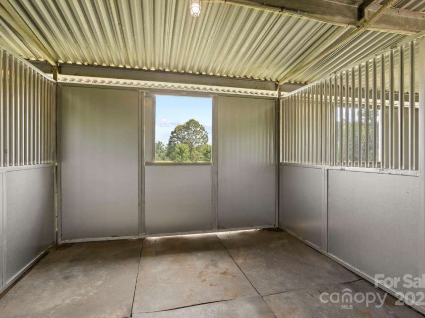 1896 Green Creek Drive, Tryon, NC 28782.  MLS# CAR4258219, YatesRealty ID 14223. All stalls are complete with mats