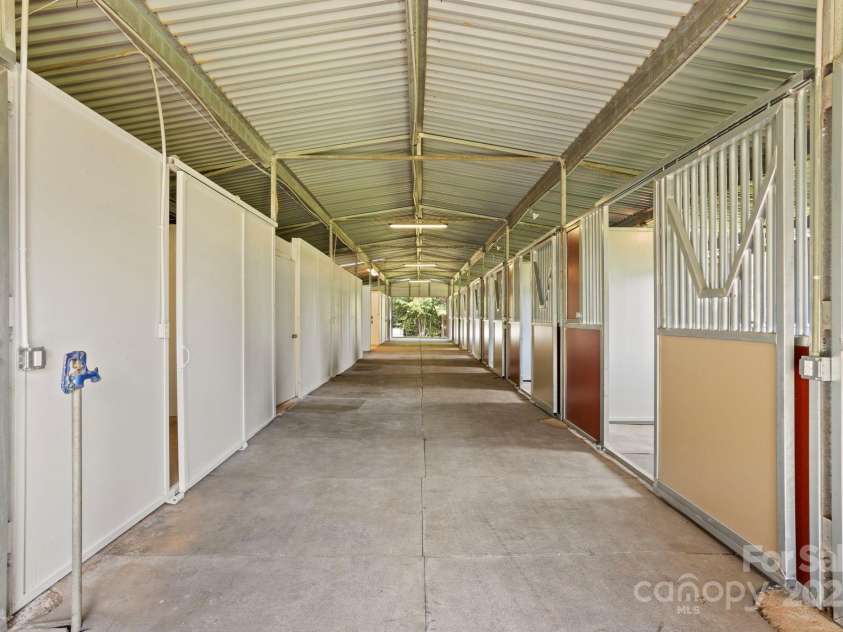 1896 Green Creek Drive, Tryon, NC 28782.  MLS# CAR4258219, YatesRealty ID 14223. All ten stalls are brand new!