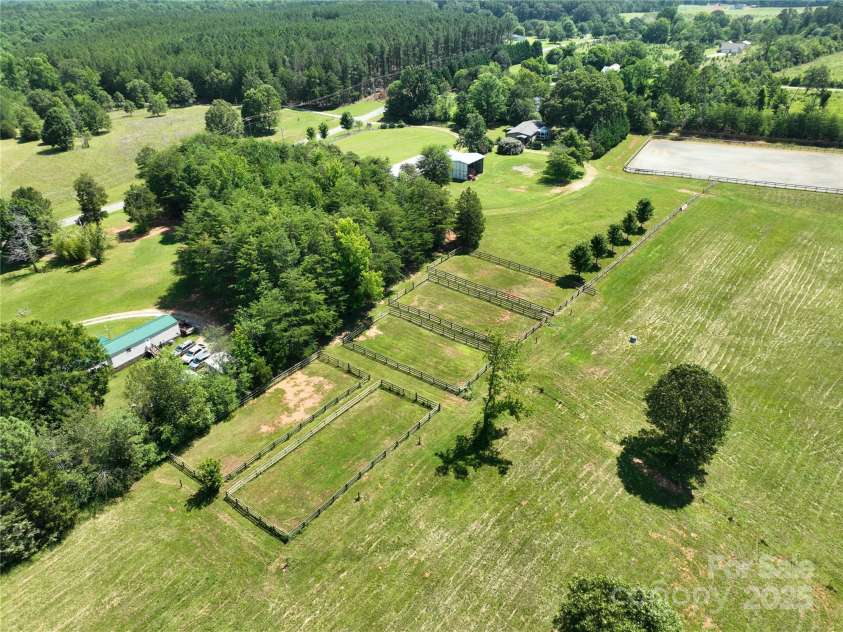 1896 Green Creek Drive, Tryon, NC 28782.  MLS# CAR4258219, YatesRealty ID 14223. Property has a total of 5 paddocks