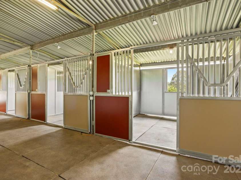 1896 Green Creek Drive, Tryon, NC 28782.  MLS# CAR4258219, YatesRealty ID 14223. Stalls are 12x12