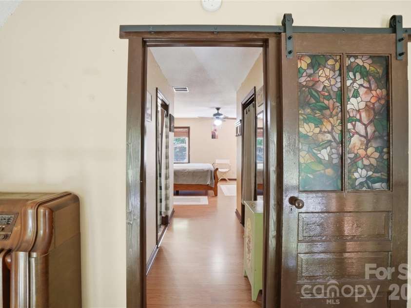 4460 Mullis Road, Kannapolis, NC 28083.  MLS# CAR4373341, YatesRealty ID 14231. Barn door access to the primary bedroom suite