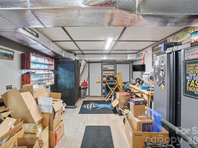 4460 Mullis Road, Kannapolis, NC 28083.  MLS# CAR4373341, YatesRealty ID 14231. Basement workshop area