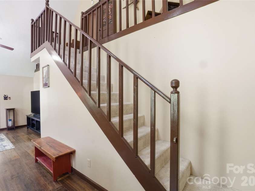 4460 Mullis Road, Kannapolis, NC 28083.  MLS# CAR4373341, YatesRealty ID 14231. Stairs to upper loft and primary bedroom