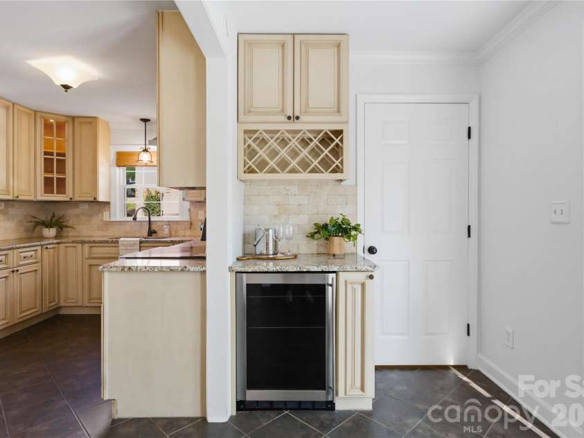 620 Shawnee Drive, Charlotte, NC 28209.  MLS# CAR4368802, YatesRealty ID 14235. Wine fridge and utility closet for water heater/ laundry 