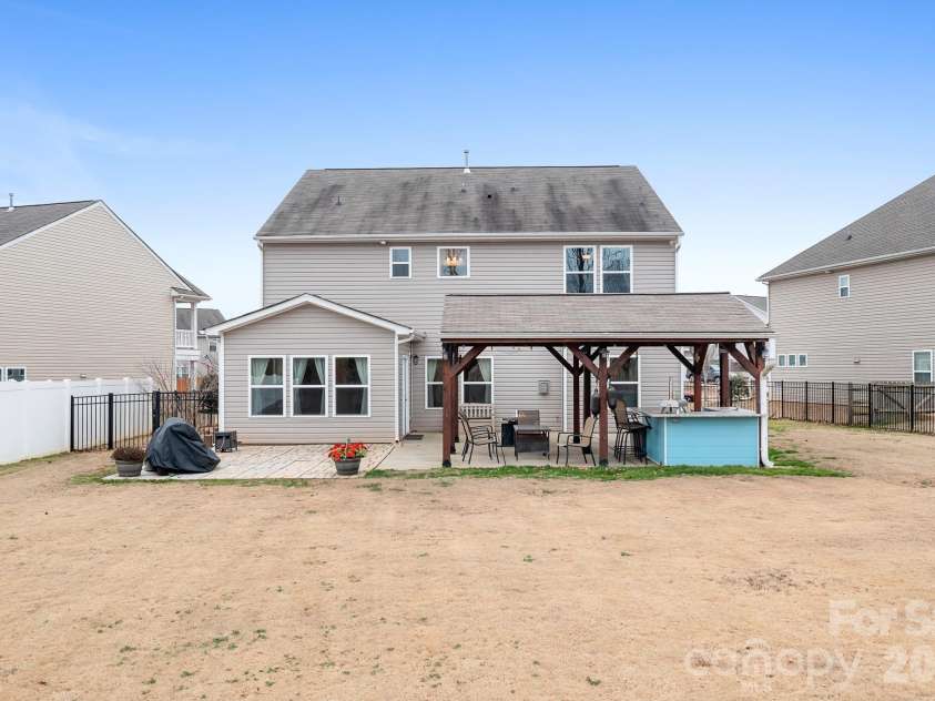 6308 Durango Way, Denver, NC 28037.  MLS# CAR4336580, YatesRealty ID 14236. Backyard Pavilion with patio, covered pavilion, two TVs, gas hookup for grill or fireplace, and bar. Perfect for entertaining.