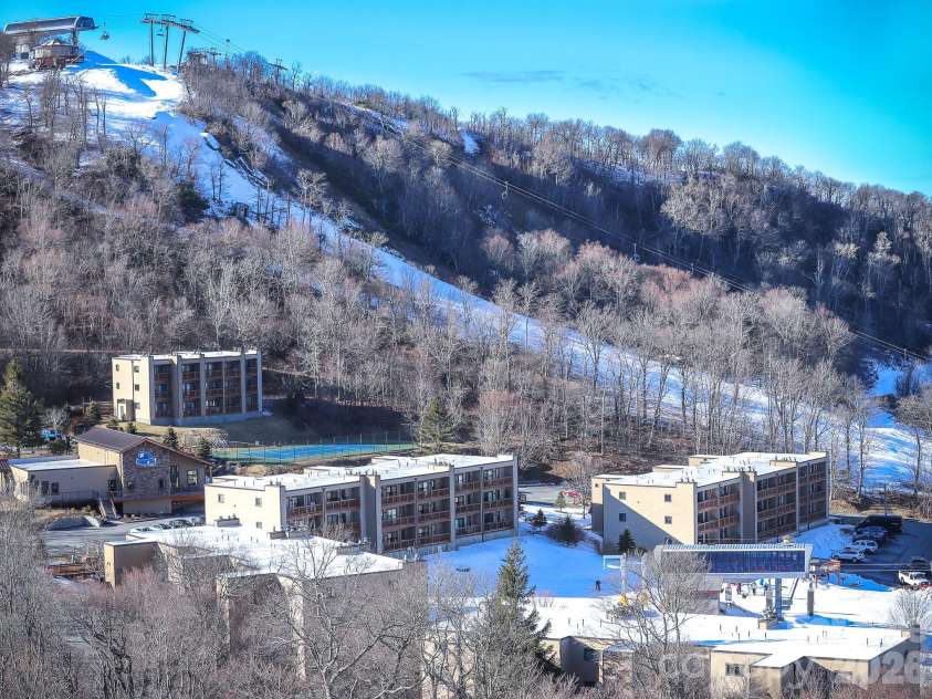 103 Sugar Ski Drive, Banner Elk, NC 28604.  MLS# CAR4405644, YatesRealty ID 14243. A slope in front and a slope behind