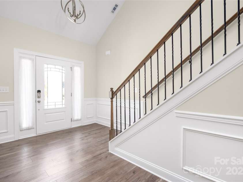 9026 Raven Top Drive, Mint Hill, NC 28227.  MLS# CAR4316455, YatesRealty ID 14246. Lovely hardwoods throughout the main level.  The open and wide foyer leads you to an open concept design.