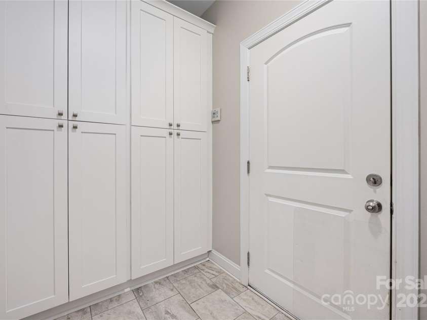 9026 Raven Top Drive, Mint Hill, NC 28227.  MLS# CAR4316455, YatesRealty ID 14246. Opposite side of the laundry room that showsthe added floor to ceiling cabinets.
